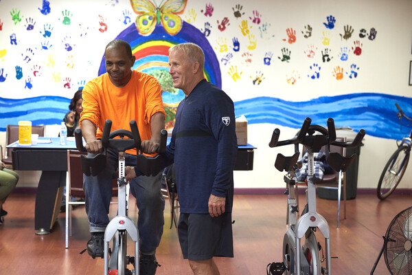 patient working out on a stationary bike