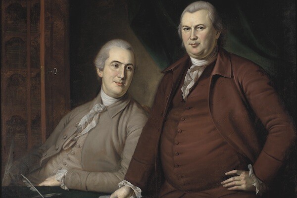 Oil painting depicts two men in 18th century dress and powdered wigs at a desk, one sitting down, the other standing.