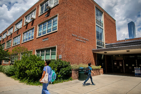 two people walking in front of the david rittenhouse laboratory building