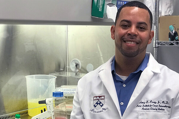 Avery Posey in a medical lab wearing a white coat.