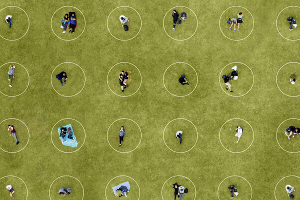 people six feet apart in a park