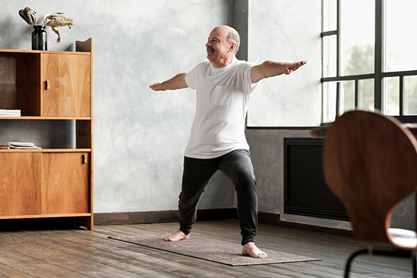 Person performs a yoga pose in a home