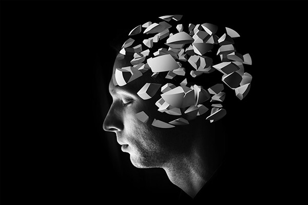 Profile of human head with brain made up of 3D shapes