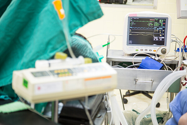 Heart rate being monitored on cardiogram in a hospital room.