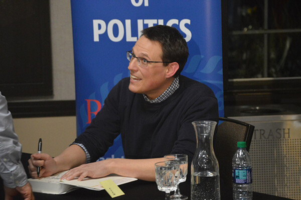 Steve Kornacki talking while signing his book.