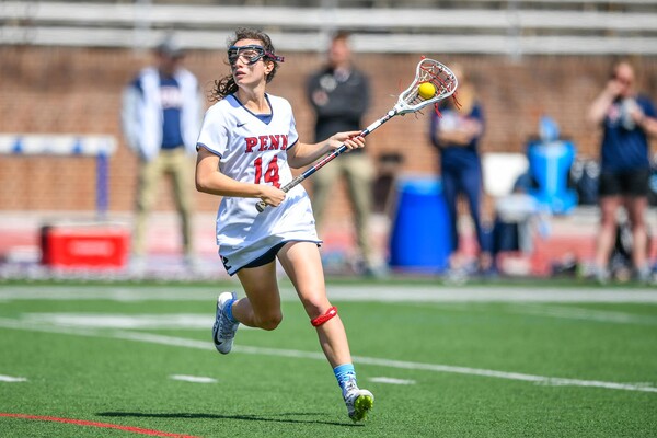 With the ball in her stick, Zoe Belodeau makes a move on the open field.