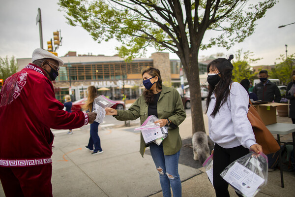 nursing students handing out masks
