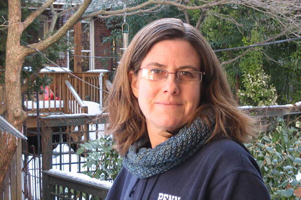 Karen Detlefsen on a back porch in the snow.