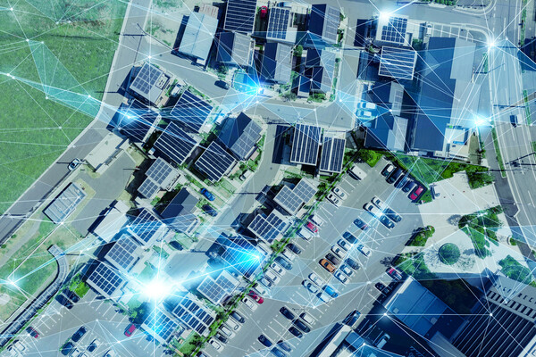 ariel view of city with tops of buildings and parked cars