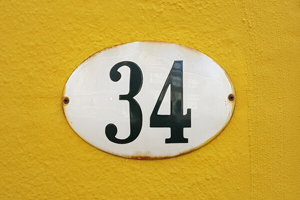 House number sign that reads 34.