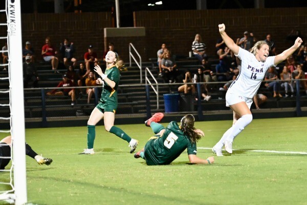 Mia Shenk, right, celebrates after scoring the game-winning goal against George Mason at Rhodes Field.