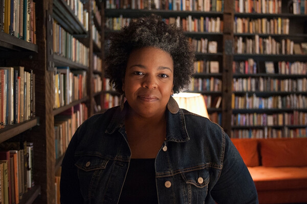 Samantha Hill standing in a library.