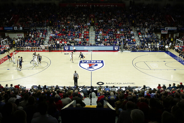 Penn plays Villanova at a packed and crowded Palestra. Villanova has the ball just past half court.