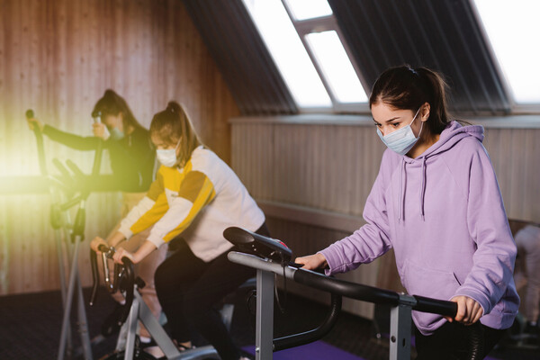 People working out on excercise machines.