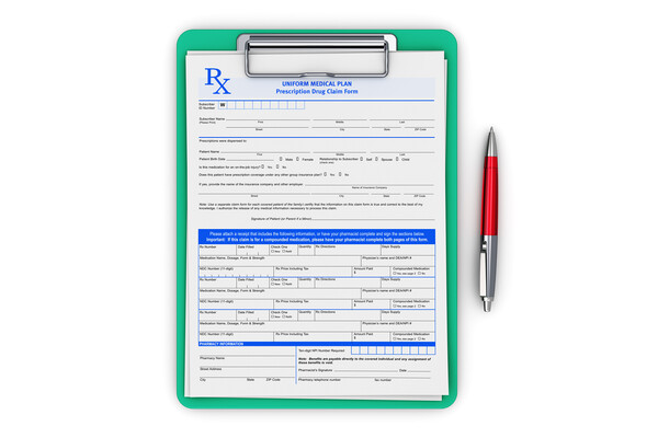 Prescription form on a clipboard.