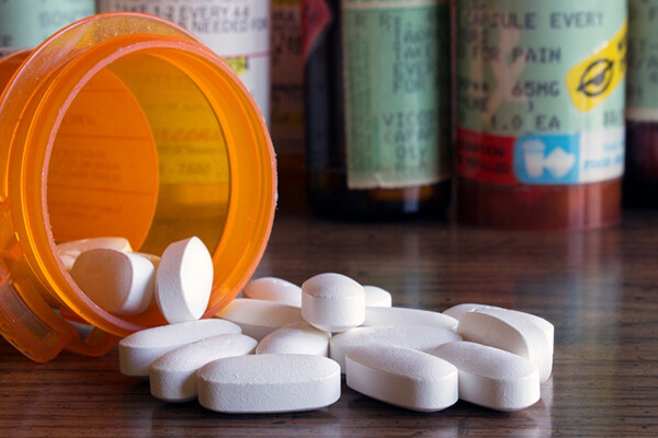 Opioid bottle with pills. 