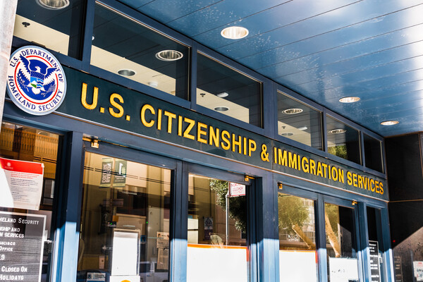 Outside of  a U.S. & Immigration building.