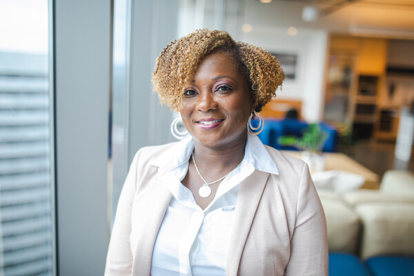 Headshot of Tyra Moore in an office