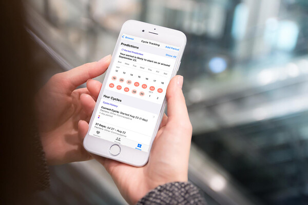 Person holding a smartphone with an App open.