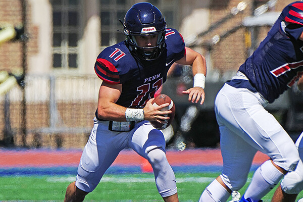 Andrew Paolini makes a move with the ball while in the pocket.