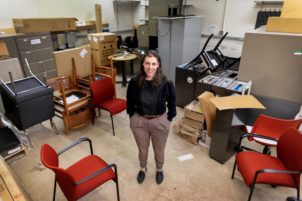 Danielle Cavalcanto surrounded by furniture.