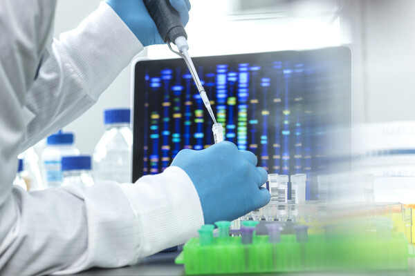 A medical professional conducting genetic testing in a lab.