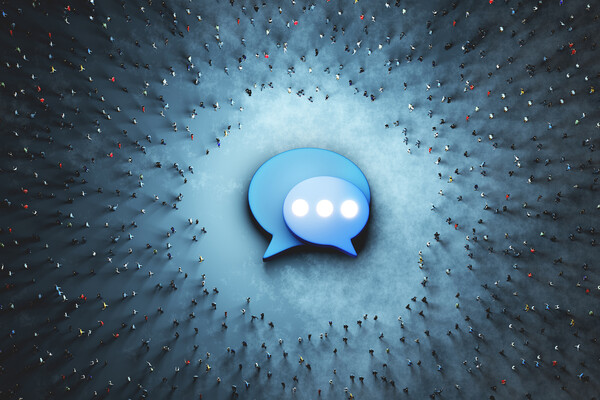 A Twitter icon on the ground with a large crowd of people circling, as seen from above.