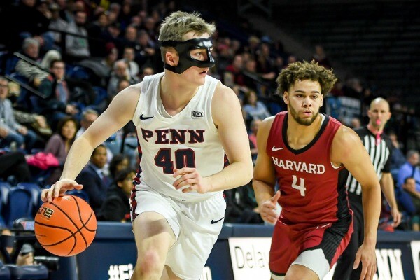 Second-year guard George Smith dribbles the ball up the court against Harvard at the Palestra.