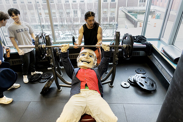 During the Pottruck Center's 20th anniversary celebration on Jan. 20, the Penn Quaker does a bench press in the second-floor weight room.
