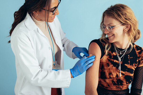 A person getting a vaccine shot.