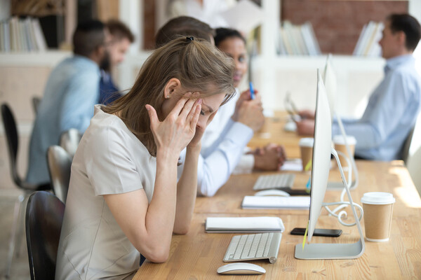 A stressed person in an office.