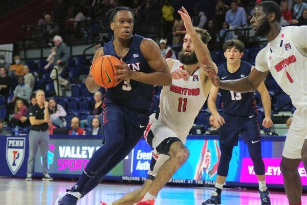 Jordan Dingle dribbles to the basket during a game against Hartford.