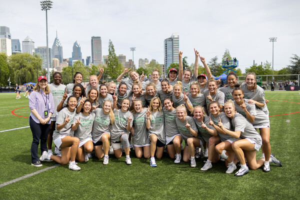 upenn women's lacrosse 2023 champs posed with President Liz Magill