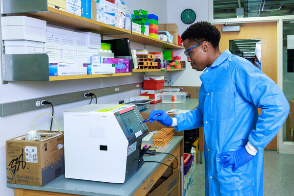 A person working in a medical lab.