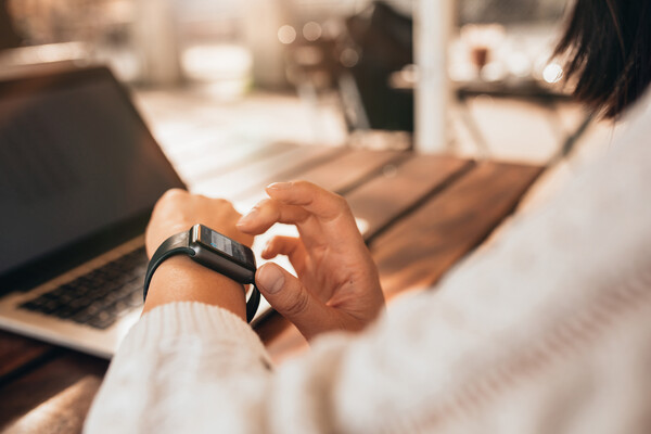 A person checking their smartwatch.