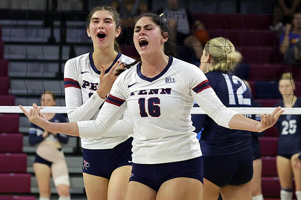 Bella Rittenberg celebrates with a teammate after making a big play during a game.