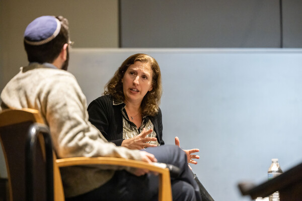 Dara Horn speaking and gesturing with her hands.
