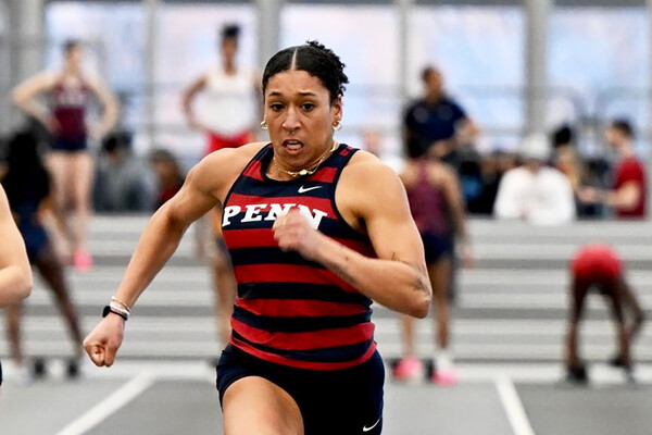  Isabella Whittaker races down the track during an indoor meet.