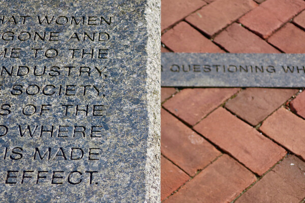 Partial view of a bench and walkway from Jenny Holzer’s 125 Years installation on Penn’s campus.