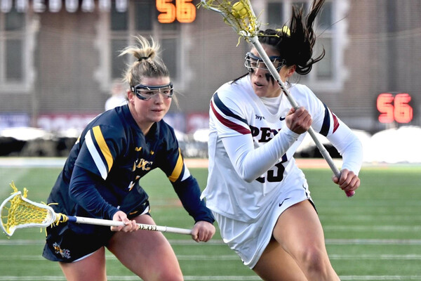 A Drexel lacrosse player against a Penn lacrosse player.
