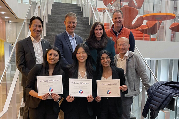 The LilyLoop team holding their certificates with the awards panel members.