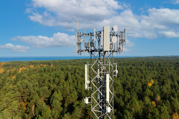 Telecommunication tower with cellular antennas.