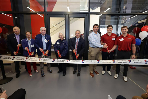 Penn Athletics coaches and administrators cut the ribbon for the Coulson Family Training Complex in Franklin Field.