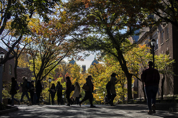 Penn students walking on campus.