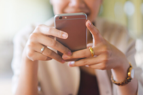 Person looking at a smartphone.