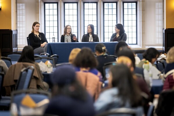 Allyson Mackey, Melissa Kelly, Ping Wang, and Vanessa Chan speaking to audience.
