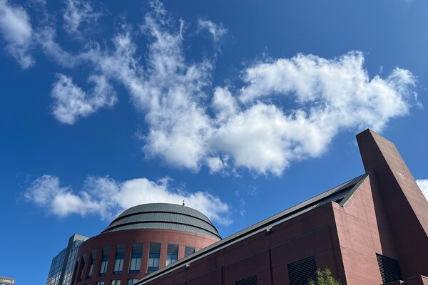 The exterior of Penn’s Huntsman building with a blue sky.
