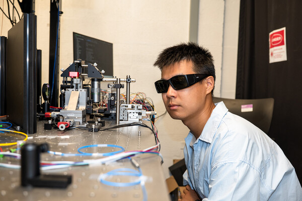 Yichi Zhang wearing sunglasses in the Penn Engineering lab.