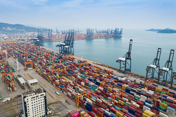 Shipping containers lined up outside a port in China.