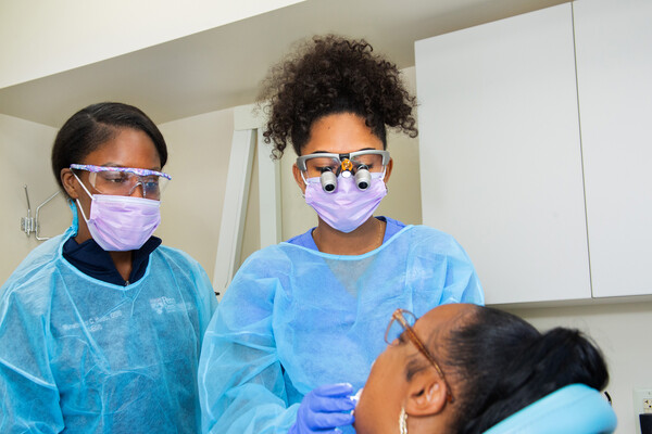 Dental residents treat a patient at Penn Dental at Woods.